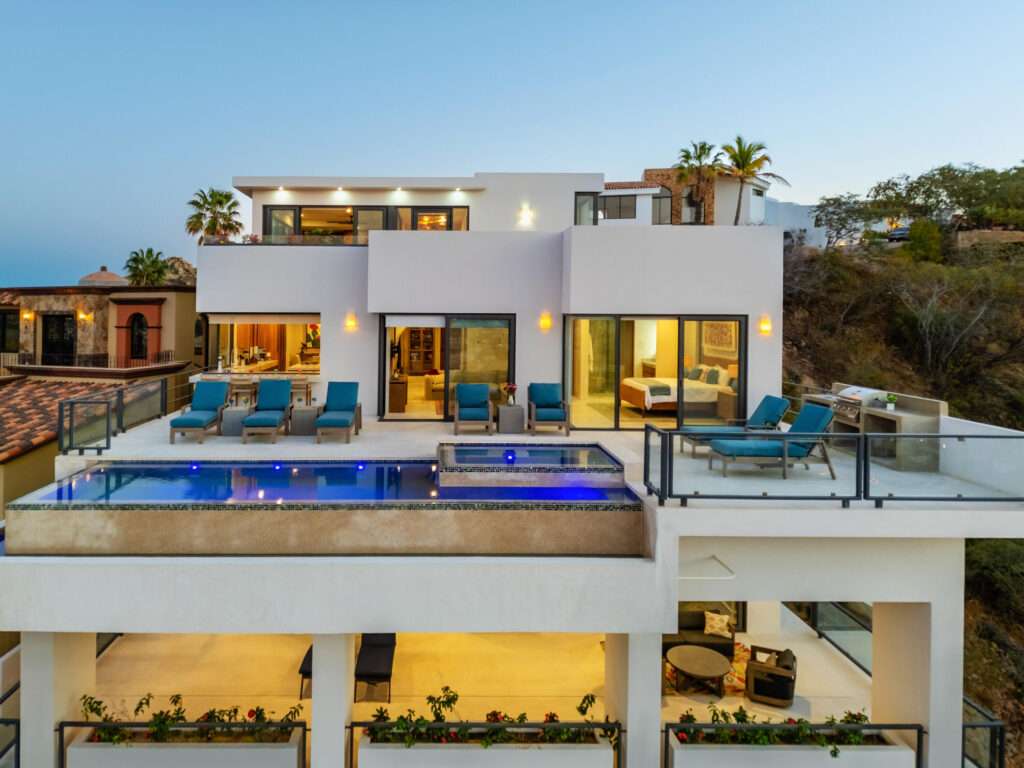 Cabo del Sol El Posito We are excited to introduce Casa Elisabeth, an amazing, newly constructed custom home in the private El Posito area of Todos Santos. Located just three rows back from the beach, this three-bedroom, three-full and two-half bathroom residence offers every amenity desired for a tropical paradise. The downstairs features an open-concept living room, dining room, and a fully stocked kitchen with brand-new appliances, including a dishwasher. The main floor also includes a laundry room and an outdoor water feature with a professionally designed rock wall. The principal bedroom downstairs offers a unique indoor/outdoor bathroom with two showers and an outdoor bathtub.Each of the three bedrooms includes an en-suite bathroom with double vanities. The upstairs bedroom features its own private furnished terrace and access to one of four large patios, complete with a bar area and outdoor furniture perfect for enjoying ocean sunsets. Additionally, a shaded third-floor observation deck provides panoramic ocean and mountain – Cam. Grande, Cabo San Lucas, BS