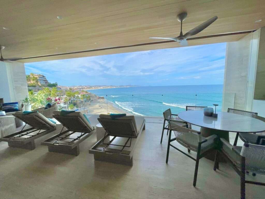 Cabo del Sol El Posito We are excited to introduce Casa Elisabeth, an amazing, newly constructed custom home in the private El Posito area of Todos Santos. Located just three rows back from the beach, this three-bedroom, three-full and two-half bathroom residence offers every amenity desired for a tropical paradise. The downstairs features an open-concept living room, dining room, and a fully stocked kitchen with brand-new appliances, including a dishwasher. The main floor also includes a laundry room and an outdoor water feature with a professionally designed rock wall. The principal bedroom downstairs offers a unique indoor/outdoor bathroom with two showers and an outdoor bathtub.Each of the three bedrooms includes an en-suite bathroom with double vanities. The upstairs bedroom features its own private furnished terrace and access to one of four large patios, complete with a bar area and outdoor furniture perfect for enjoying ocean sunsets. Additionally, a shaded third-floor observation deck provides panoramic ocean and mountain – Querencia B, San Jose Corridor, BS