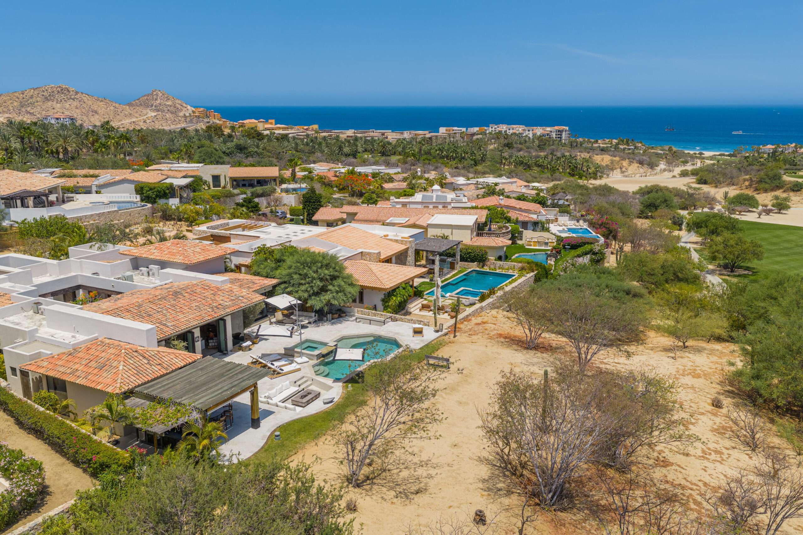 Cabo del Sol Brisas Discover Naah Payil, an exceptional estate where the warmth of a Contemporary Mexican Hacienda blends seamlessly with the relaxed sophistication of coastal living. Located within one of Los Cabos' most exclusive and secure communities, this architectural masterpiece was custom-designed by MCA, led by renowned architect Antonio Carrera. Thoughtfully enhanced in 2015 and again in 2025, the residence beautifully balances timeless character with today's highest standards of comfort and design. At the heart of the home, a central courtyard anchored by a signature tree creates a tranquil gathering space filled with natural light. The home's thoughtful design embraces effortless indoor-outdoor living. Open the grand living room doors, and refreshing ocean breezes naturally flow throughout the residence, creating a comfortable and inviting atmosphere – 12 Cabo del Sol Brisas, Cabo Corridor, BS